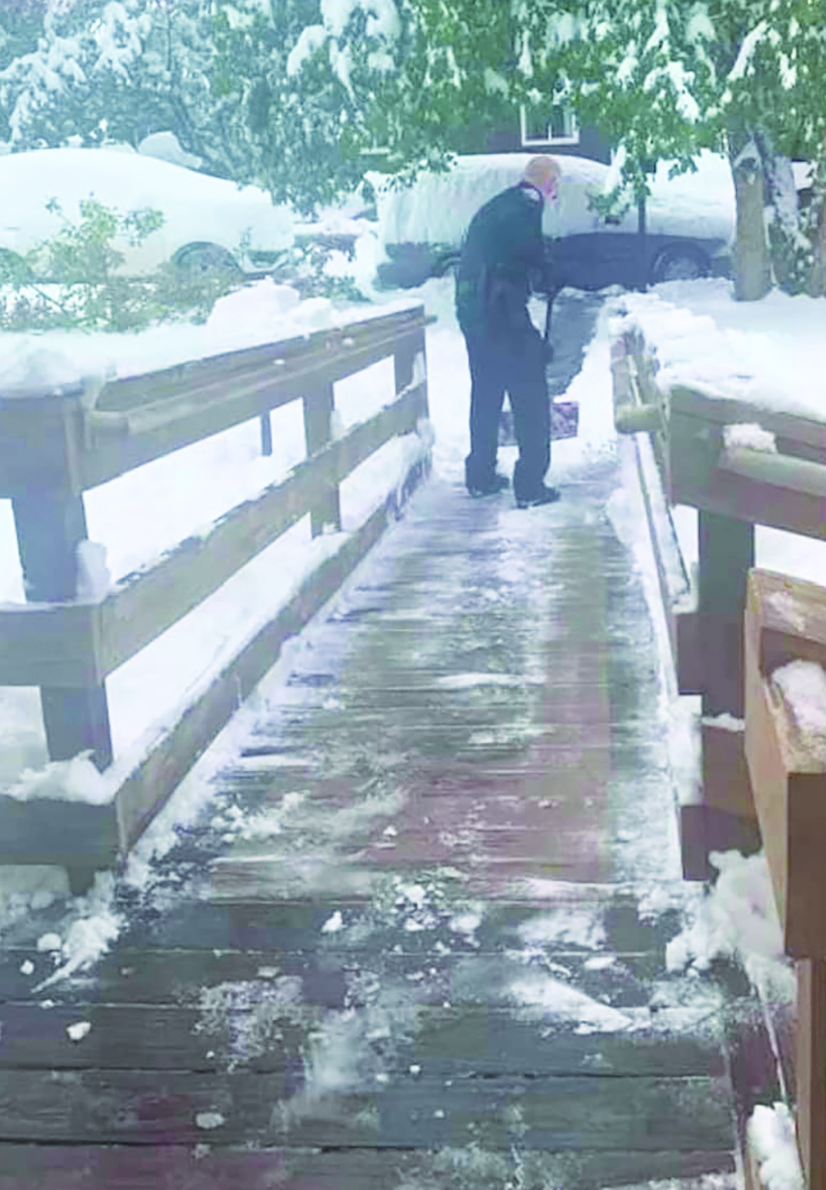 Monte Community Chief Dingfelder shovels snow